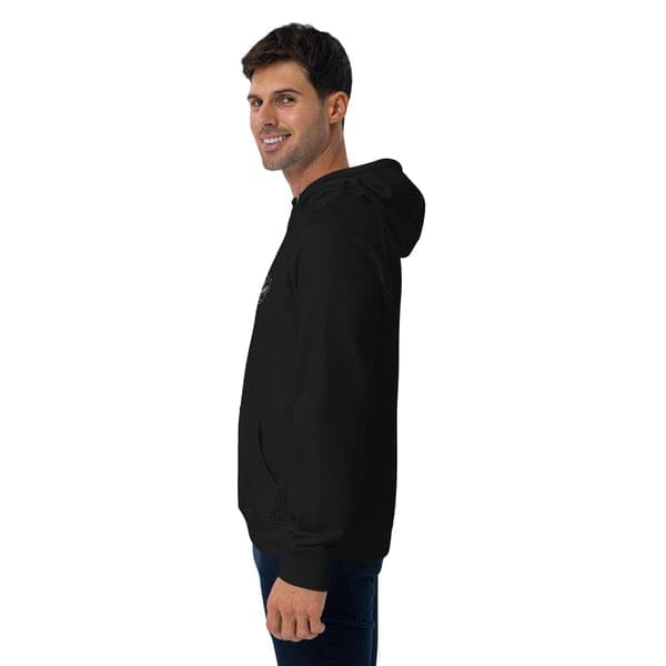 Casual man wearing a black hoodie, standing sideways and smiling, suitable for barber shop branding and male grooming services.